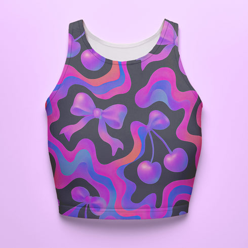 Honey Dazed Brand body-hugging racerback crop top featuring Y2K-inspired print with purple gradient cherries, holographic bows, and swirling patterns in pink, purple, and blue on black background in performance knit fabric